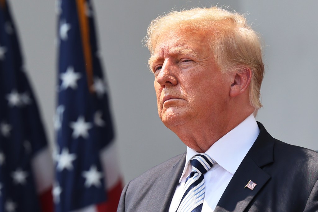 gettyimages-1327493808 Trump in front of an American flag